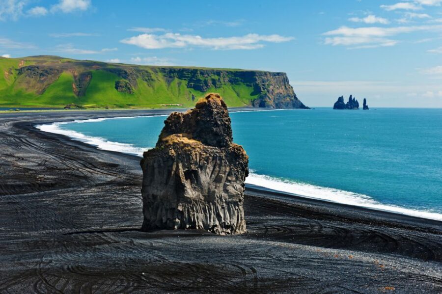 Iceland: South Coast and Northern Lights Tour - Reynisfjara black sand beach: basalt stacks, waves, and big wind