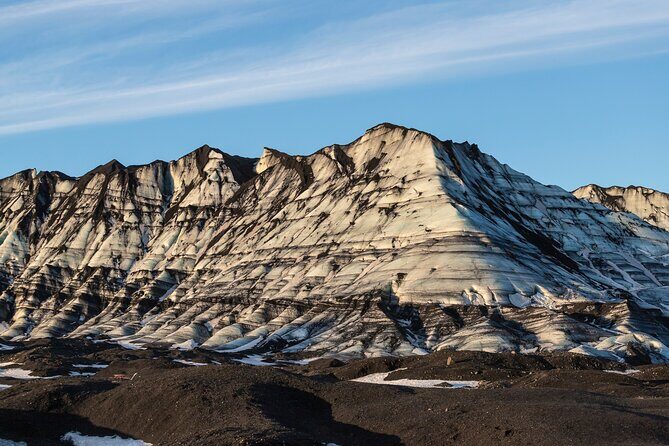 Katla Ice Cave Tour from Vik Small-Group Guided Adventure - Stop 2: walking into Katla Ice Cave with safety coaching